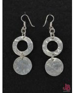 A pair of sterling silver earrings, hammered circles and disks .